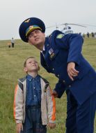 Serviceman with a boy look in sky