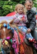 Serviceman with daughter on a horse