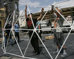 Workers assemble the ball cage