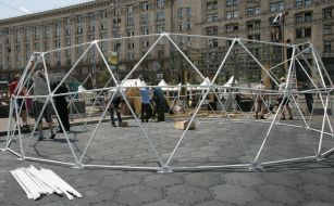 Workers assemble the ball cage