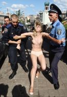 Fight of the activists FEMEN with militiaman