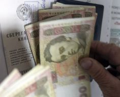 Elderly woman counts a money