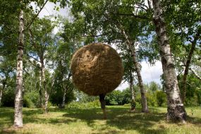 People near the sculpture
