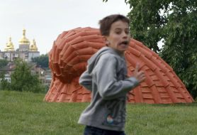 A boy near the sculpture