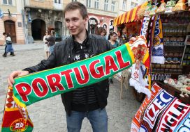 The Portuguese fan holds a scarf