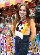 A giirl The girl near the kiosk with souvenirs