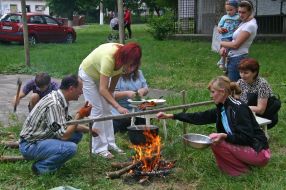 The habitants of one of houses Kalita village make dinner on a fire