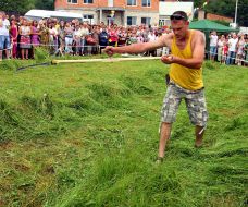 A man squints the grass