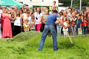 A man squints the grass