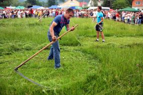 A man squints the grass