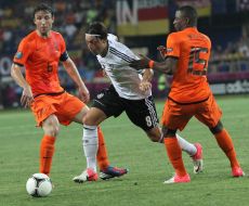 Mark van Bommel, Jethro Willems and Mesut Ozil