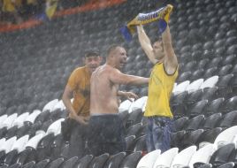 Fans of the team of Ukraine during a thundershower