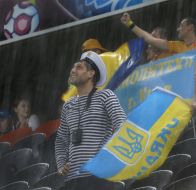 Fans of the team of Ukraine during a thundershower