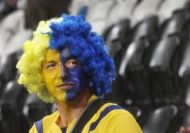 Fan of the team of Ukraine during a thundershower