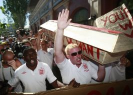 England soccer team fans carry the coffin