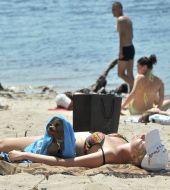 Girl with a dog on a beach in Kiev