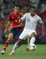 Sergio Busquets and Florent Malouda