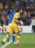Mario Balotelli and Iker Casillas
