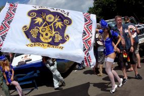 The girl in the form of flight attendants with flag