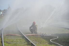 Rescuer extinguishes conditioned fire