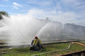 Rescuer extinguishes conditioned fire