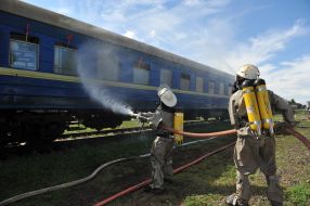 Rescuer extinguishes conditioned fire