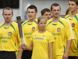Sportsmen hold the Olympic torch