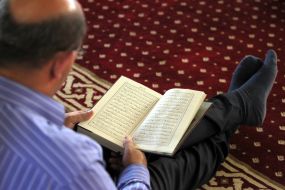 A man reads the Koran
