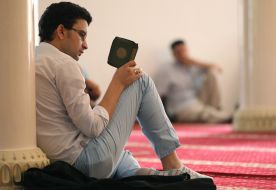 A man reads the Koran