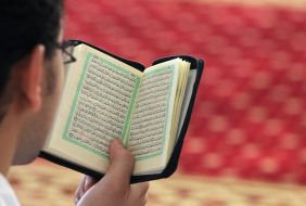A man reads the Koran