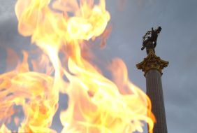 Olympic flame on the background Bereginya