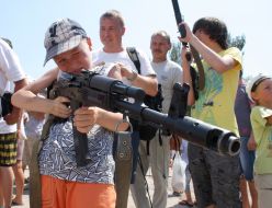 A boy holds a weapon