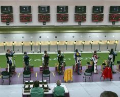 Competitioners on firing a pneumatic rifle
