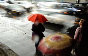 The passers under umbrellas