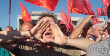 The Crimean Tatars are trying to break to the stage during a speech of Petr Simonenko