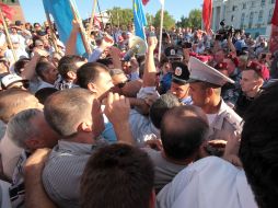 The Crimean Tatars are trying to break to the stage during a speech of Petr Simonenko