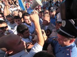 The Crimean Tatars are trying to break to the stage during a speech of Petr Simonenko