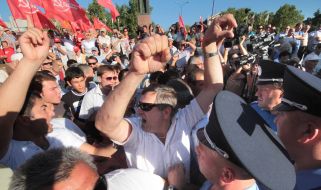 The Crimean Tatars are trying to break to the stage during a speech of Petr Simonenko