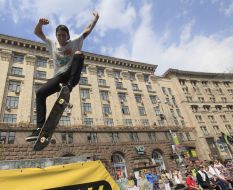 Young man executes a trick on a skateboard 