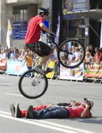 Young man executes a trick on the bicycle 
