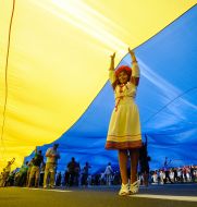 A girl standing under the flag