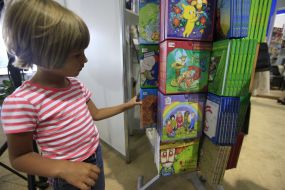 A girl examines a book