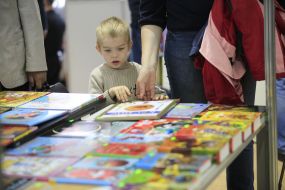 Boy examines a book