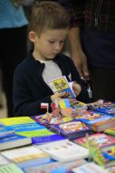 Boy examines a book