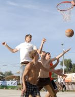 Competitors play basketball