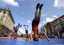Competitors stand on head