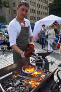 The blacksmith does a horseshoe