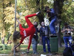 Photographers photograph participant  of flashmob