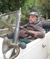 The actor sitting in a car