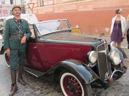 The actor stands near machine